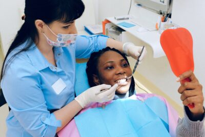 A dentist examining a patient. 