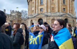 Attendees at a vigil for the war in Ukraine in Radcliffe Square, Oxford